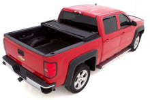 Load image into Gallery viewer, Lund 99-17 Ford F-250 Super Duty (6.5ft. Bed) Genesis Elite Tri-Fold Tonneau Cover - Black